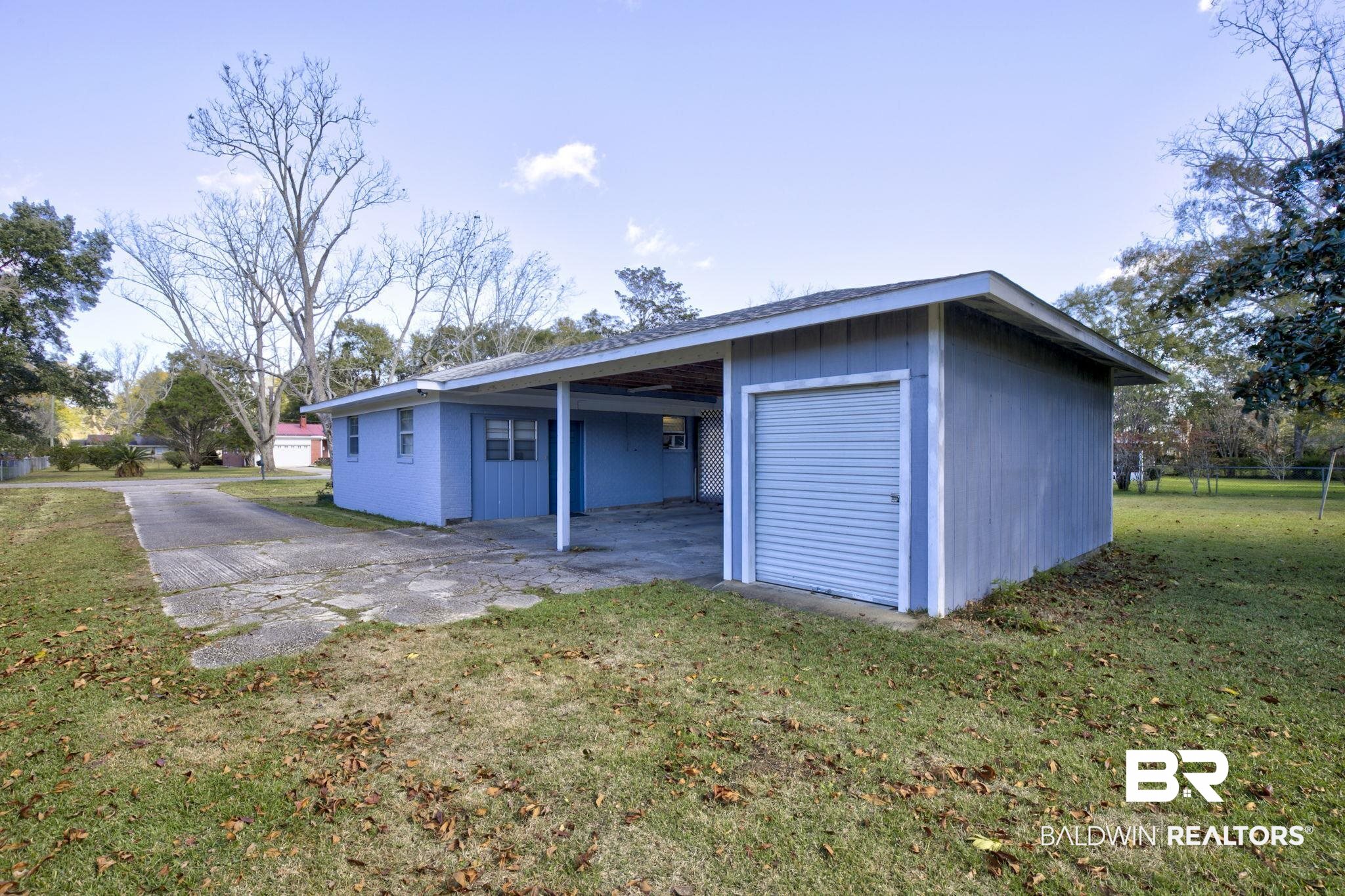 606 East Myrtle Avenue Foley, AL 36535 - Photo 19 of 24 Garage with a yard and a carport