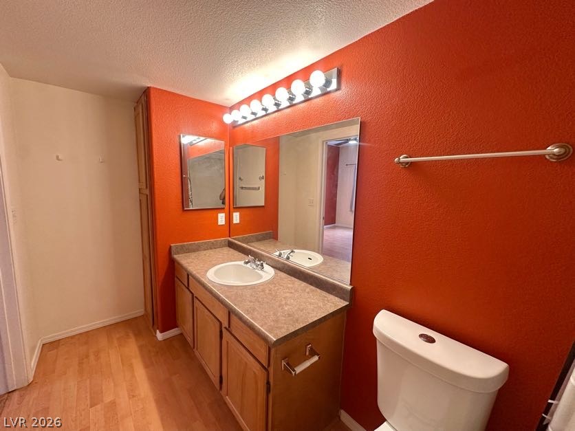 7255 West Sunset Road, Unit 1027 Las Vegas, NV 89113 - Photo 16 of 25 A well-appointed bathroom features a single vanity with ample storage and a brightly lit mirror.