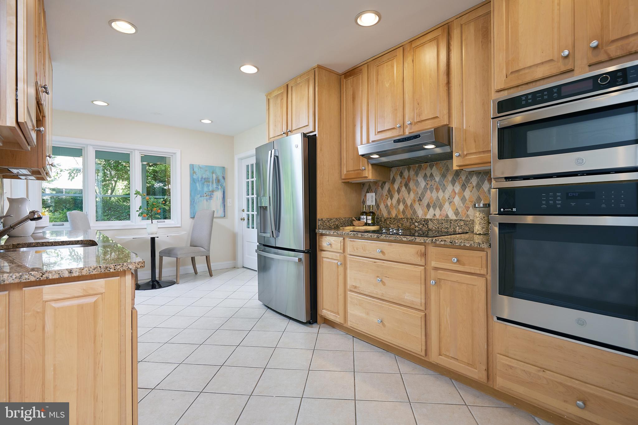5518 Uppingham Street Chevy Chase, MD 20815 - Photo 12 of 50 Chef's Kitchen with Stainless Steel Appliances
