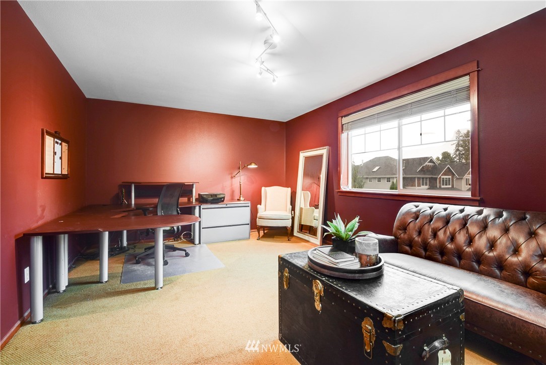 15322 43rd Avenue Southeast Bothell, WA 98012 - Photo 22 of 27 a living room with furniture a table and a large window