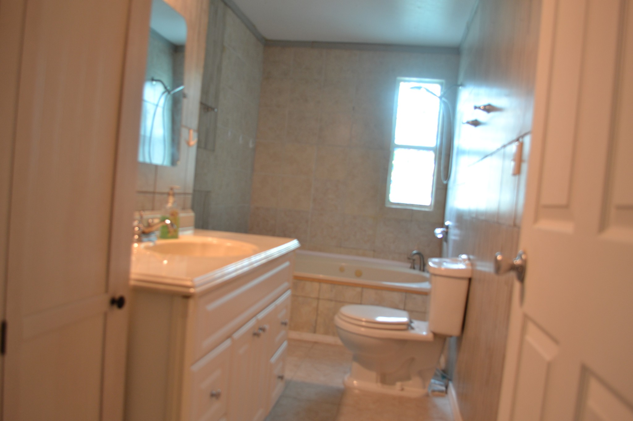 1505 Add Stafford Road Hilham, TN 38568 - Photo 14 of 65 a bathroom with a sink a toilet and mirror
