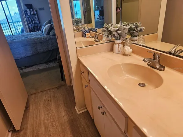 a bathroom with a sink and mirror