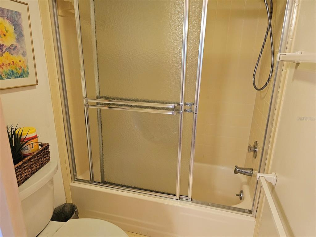 4119 61st Ave Terrace West, Unit 404 Bradenton, FL 34210 - Photo 13 of 22 a bathroom with a shower