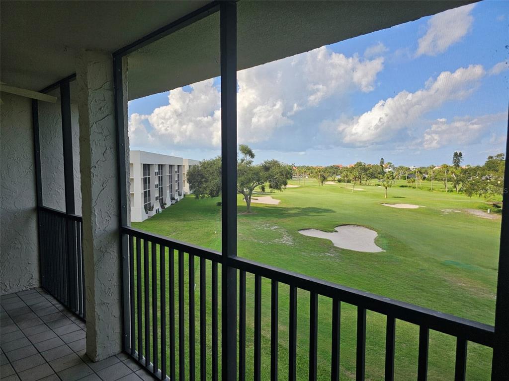 4119 61st Ave Terrace West, Unit 404 Bradenton, FL 34210 - Photo 19 of 22 a view of a balcony with a yard