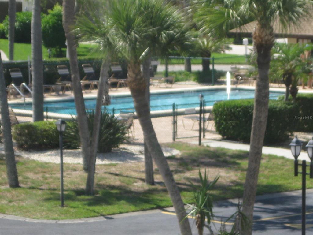 4119 61st Ave Terrace West, Unit 404 Bradenton, FL 34210 - Photo 22 of 22 a view of a yard in front of a house with a tree