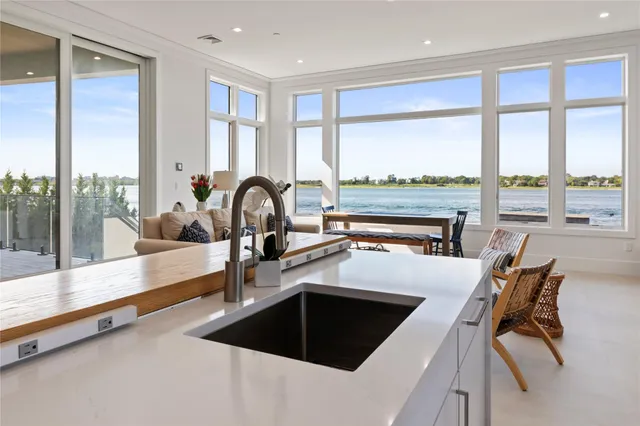 a kitchen with a large window and a sink