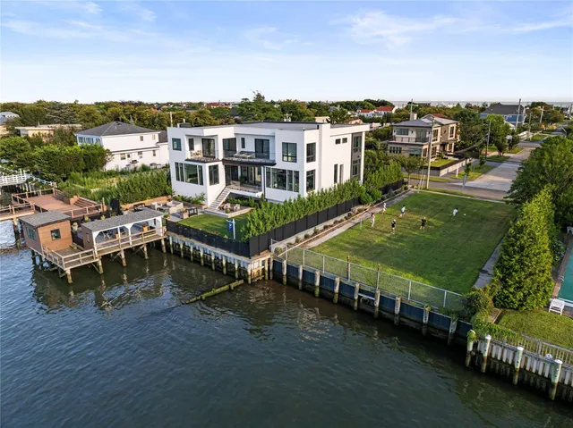 an aerial view of a house with a ocean view