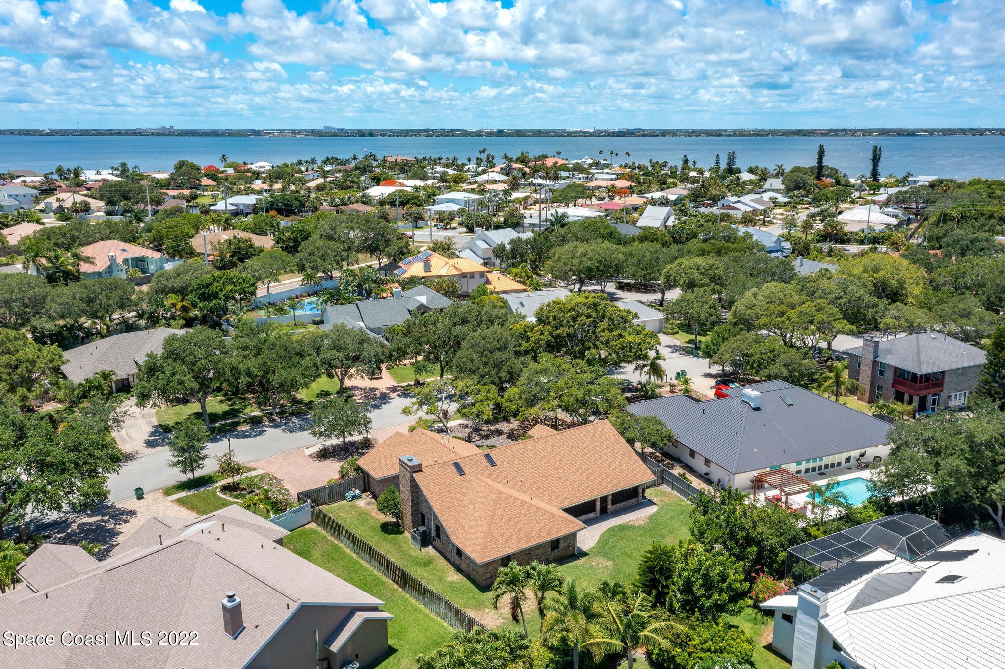 588 Peregrine Drive Indialantic, FL 32903 - Photo 18 of 23 an aerial view of a house with a lake view