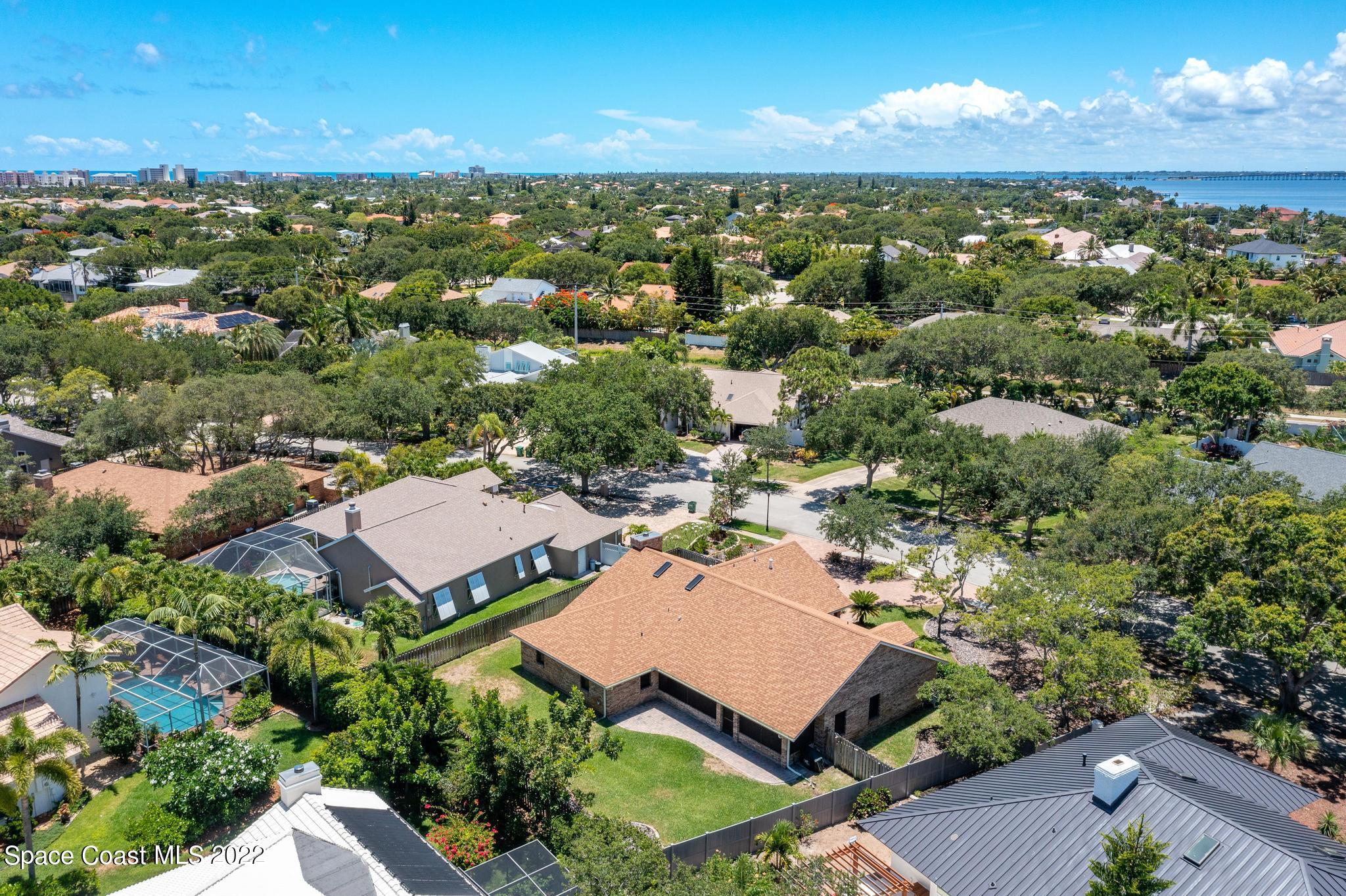 588 Peregrine Drive Indialantic, FL 32903 - Photo 19 of 23 an aerial view of residential houses with outdoor space and ocean view