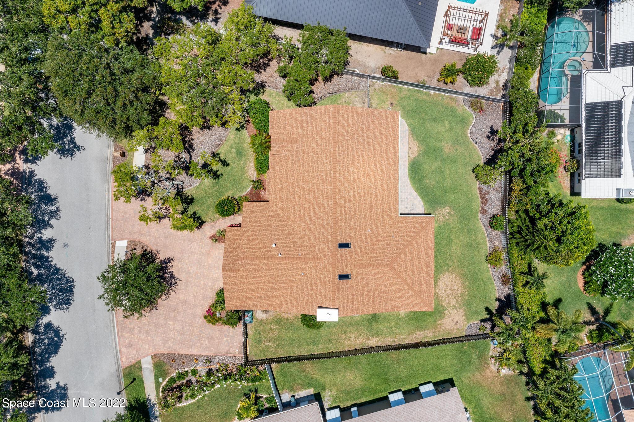 588 Peregrine Drive Indialantic, FL 32903 - Photo 22 of 23 an aerial view of a house with a yard