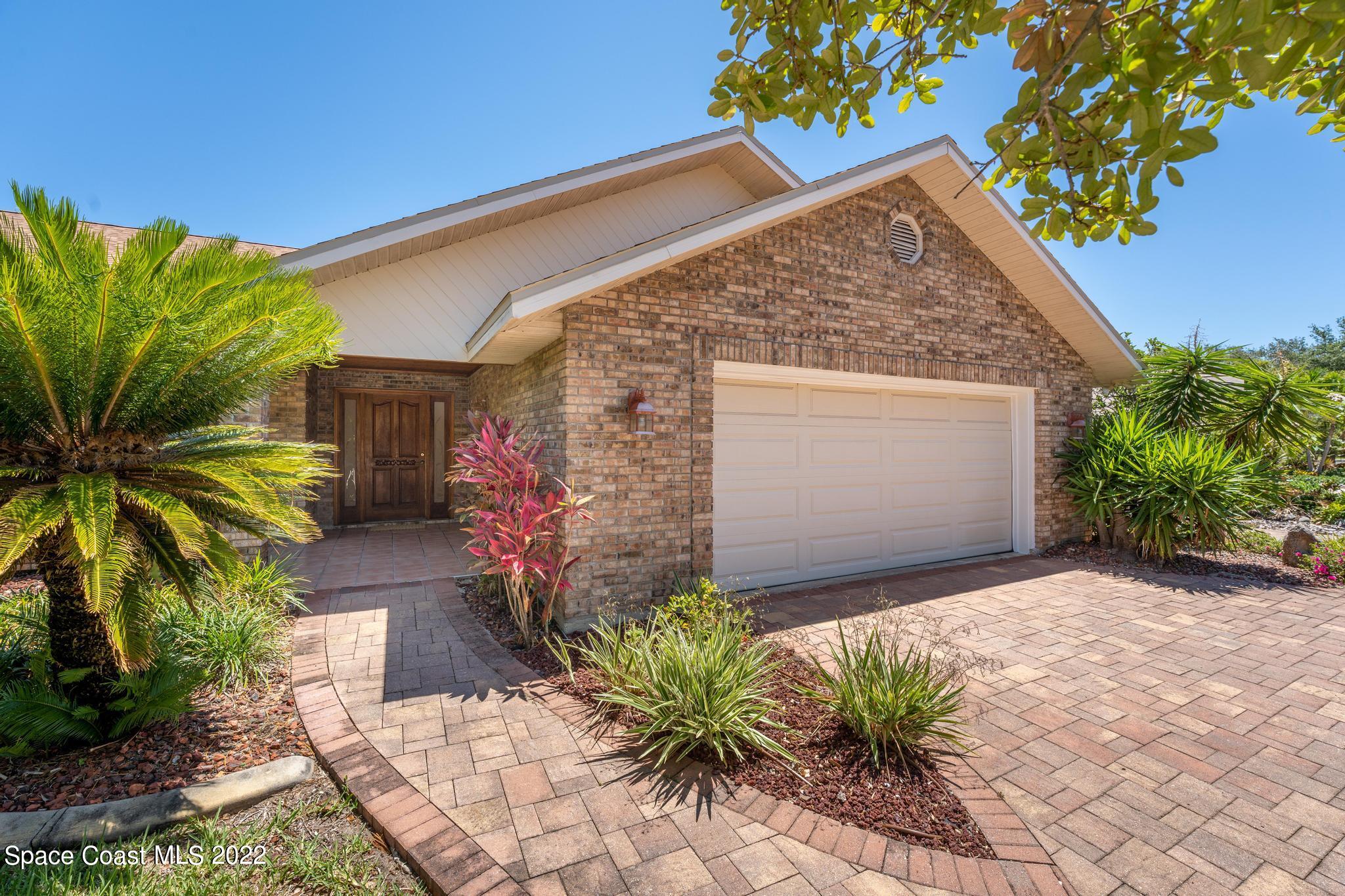 588 Peregrine Drive Indialantic, FL 32903 - Photo 23 of 23 a view of a house with a yard