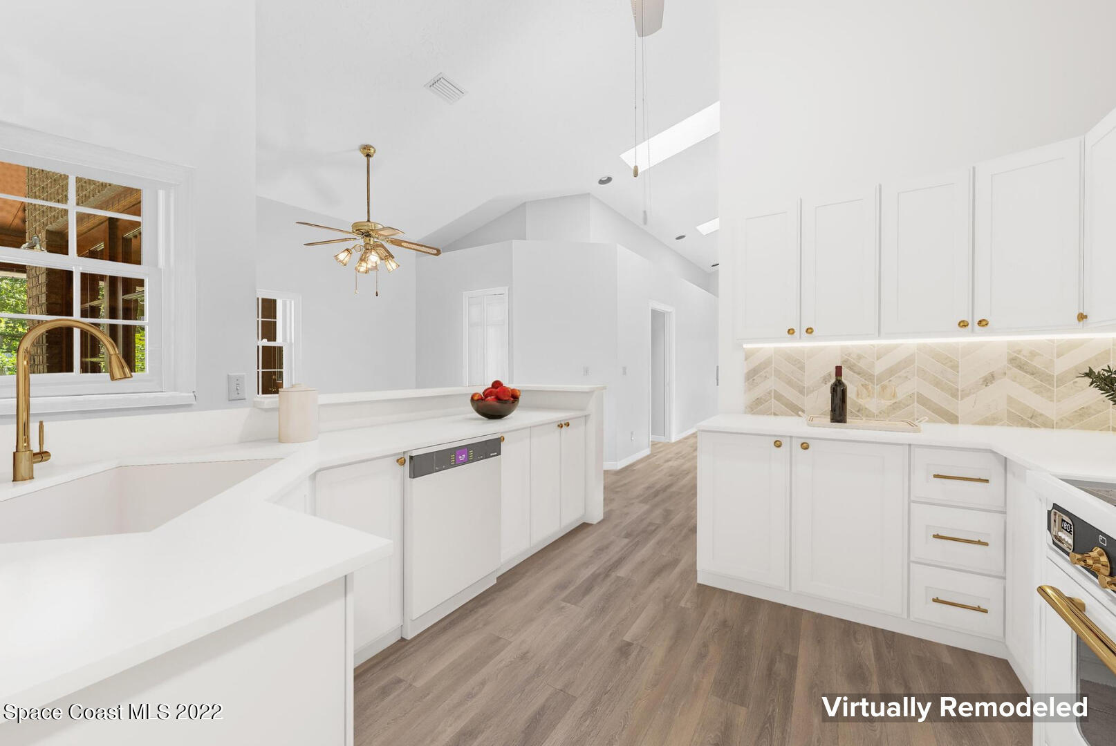 588 Peregrine Drive Indialantic, FL 32903 - Photo 6 of 23 a kitchen with cabinets a sink and appliances