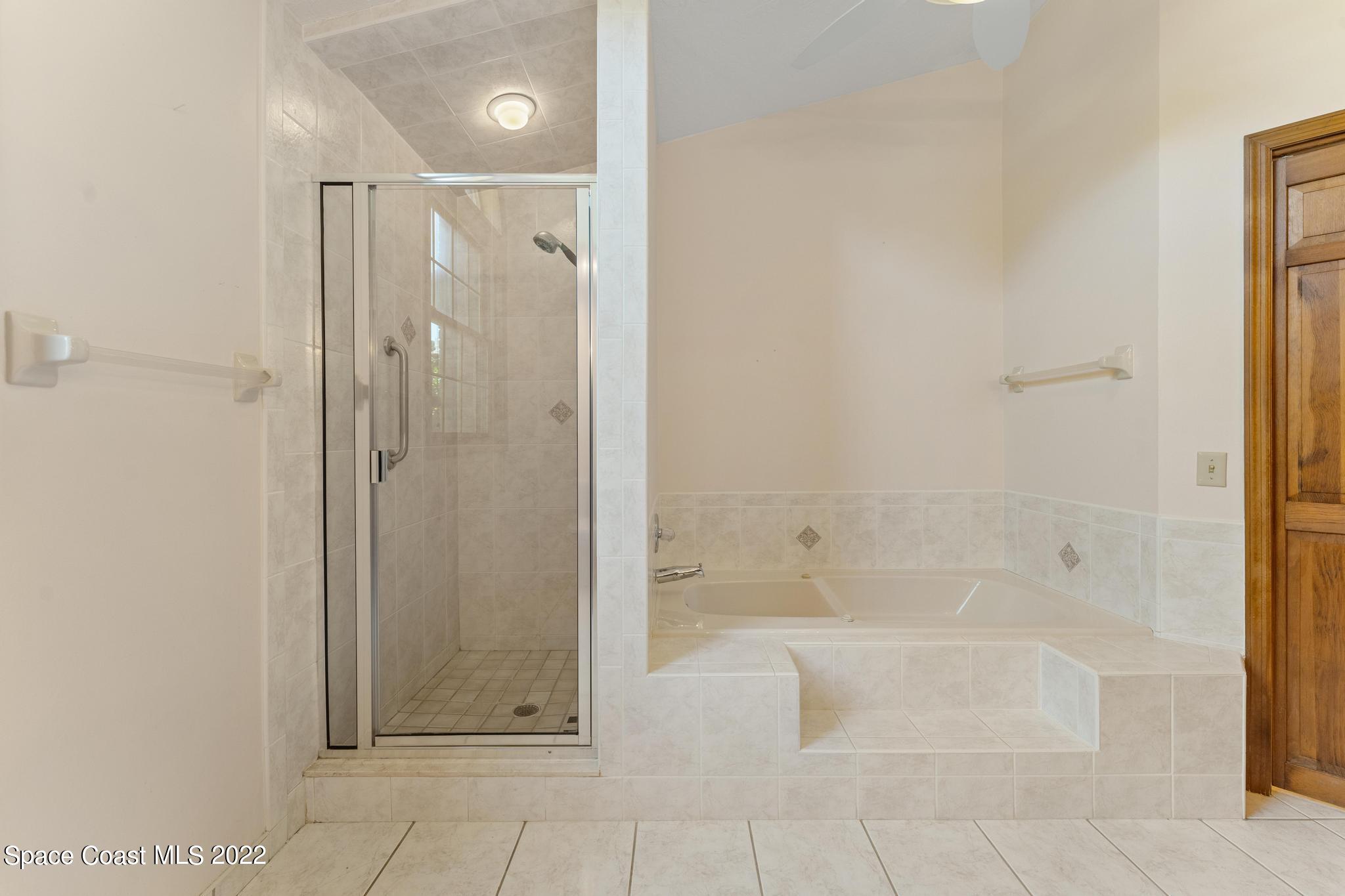 588 Peregrine Drive Indialantic, FL 32903 - Photo 10 of 23 a bathroom with a shower
