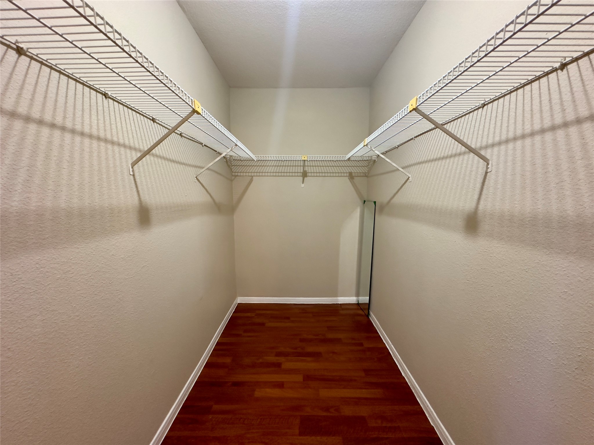 2121 Hepburn Street, Unit 1110 Houston, TX 77054 - Photo 17 of 22 Discover abundant storage in the primary bedroom's inviting, spacious walk-in closet—perfect for organizing your wardrobe with ease.