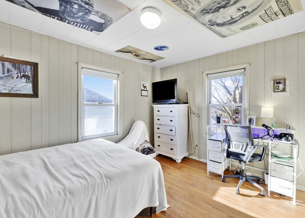 59 Prospect Street Ludlow, MA 01056 - Photo 19 of 42 a bedroom with furniture and a flat screen tv