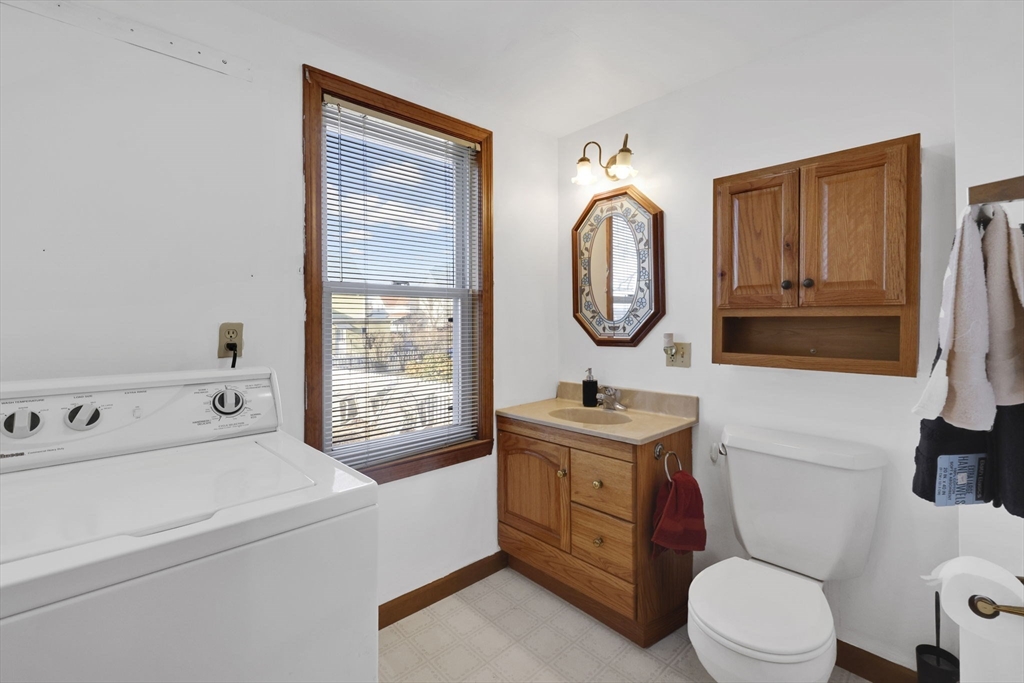 59 Prospect Street Ludlow, MA 01056 - Photo 25 of 42 a bathroom with a toilet sink and mirror