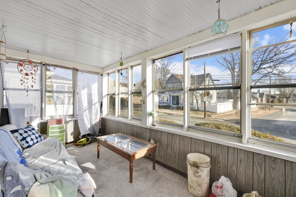 59 Prospect Street Ludlow, MA 01056 - Photo 4 of 42 a living room with furniture and a floor to ceiling window