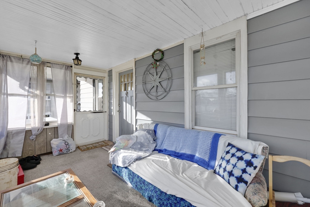 59 Prospect Street Ludlow, MA 01056 - Photo 5 of 42 a living room with furniture and a chandelier
