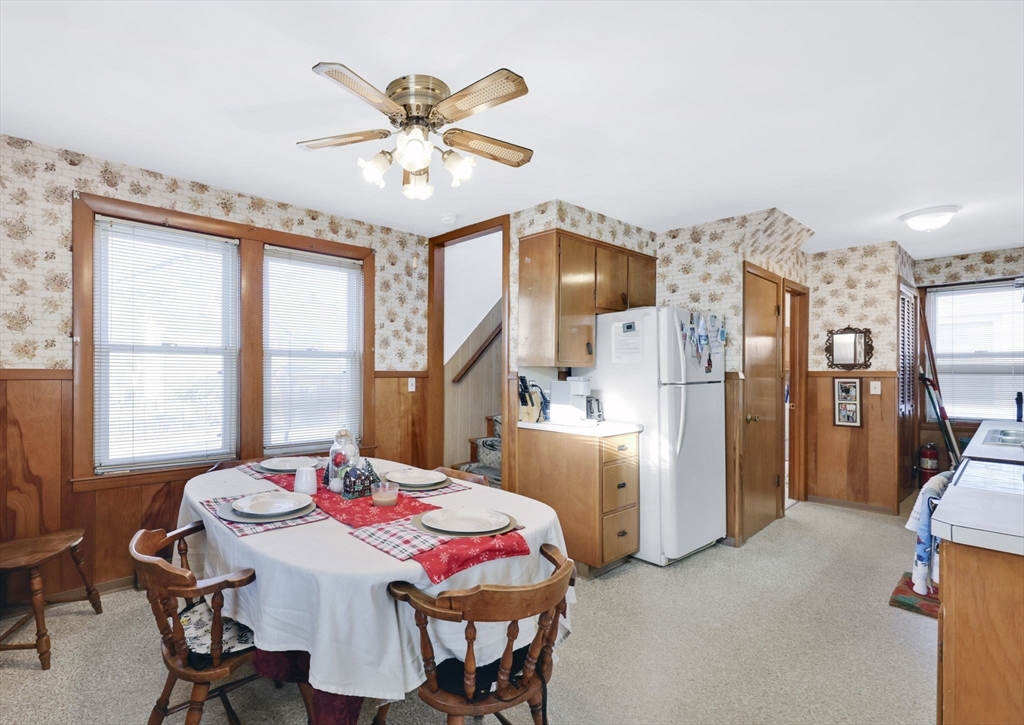 59 Prospect Street Ludlow, MA 01056 - Photo 9 of 42 a view of a dining room with furniture and a chandelier