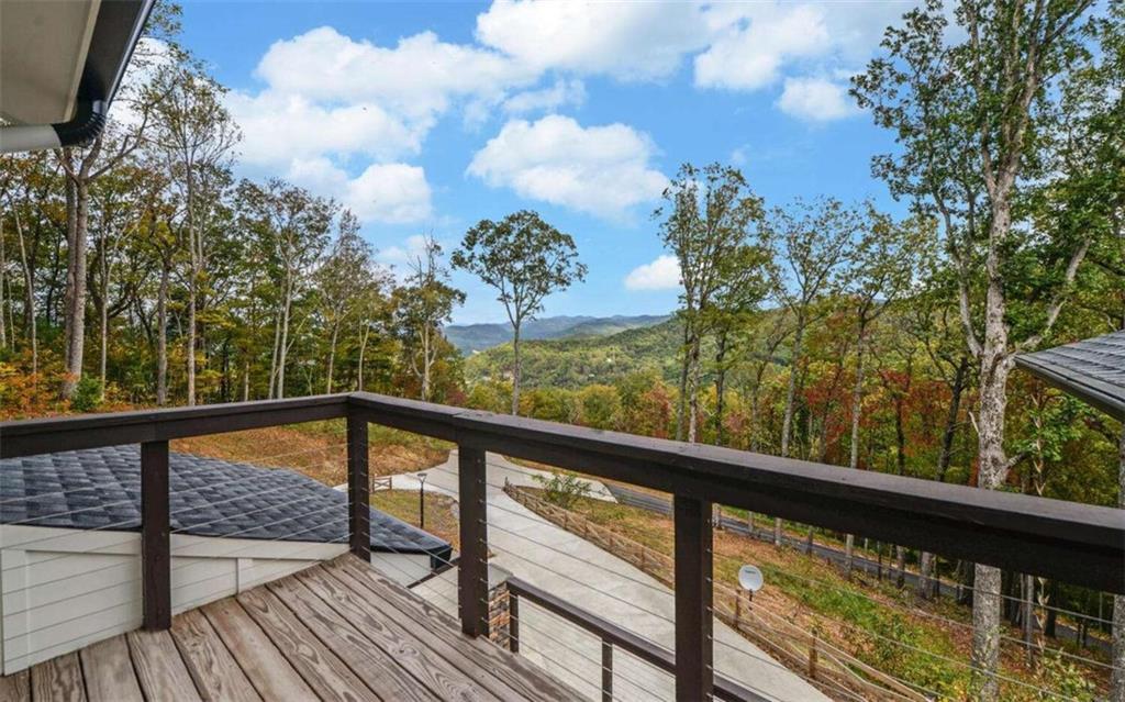 333 Favor Rabun Gap, GA 30568 - Photo 17 of 97 a view of a balcony with wooden floor and fence