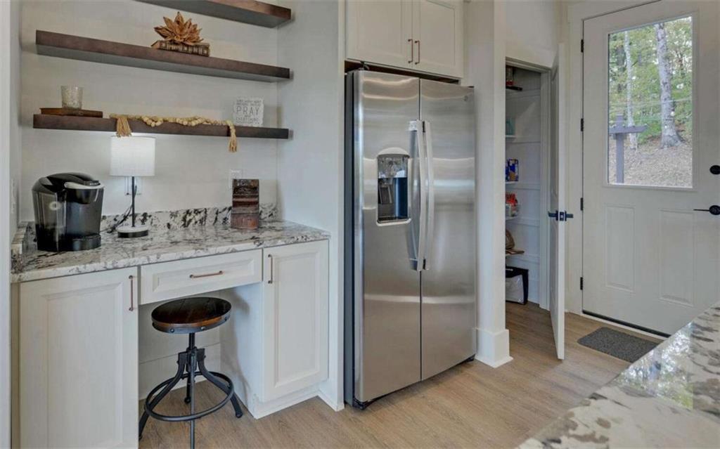 333 Favor Rabun Gap, GA 30568 - Photo 23 of 97 a kitchen with stainless steel appliances granite countertop a refrigerator and a sink
