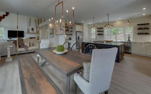 a view of a two chairs in the balcony