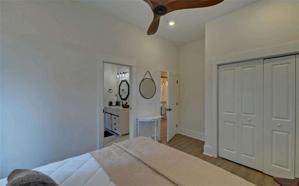 333 Favor Rabun Gap, GA 30568 - Photo 48 of 97 a bedroom with a bed and a chandelier