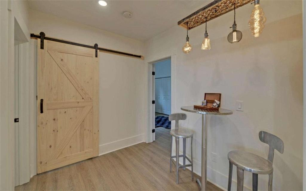 333 Favor Rabun Gap, GA 30568 - Photo 56 of 97 a view of a hallway with workspace and wooden floor