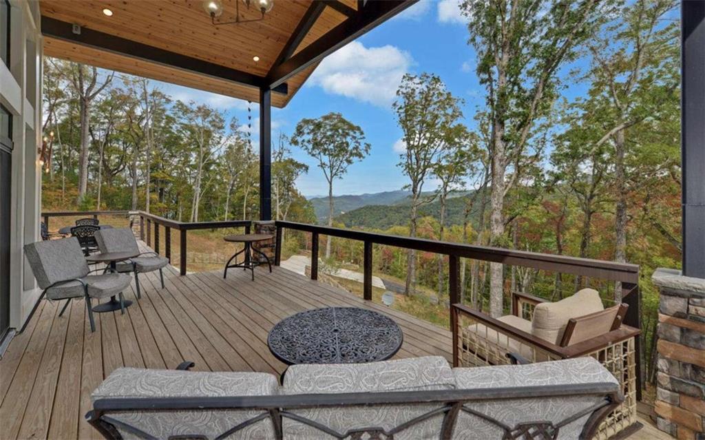 333 Favor Rabun Gap, GA 30568 - Photo 60 of 97 a balcony with wooden floor and outdoor seating