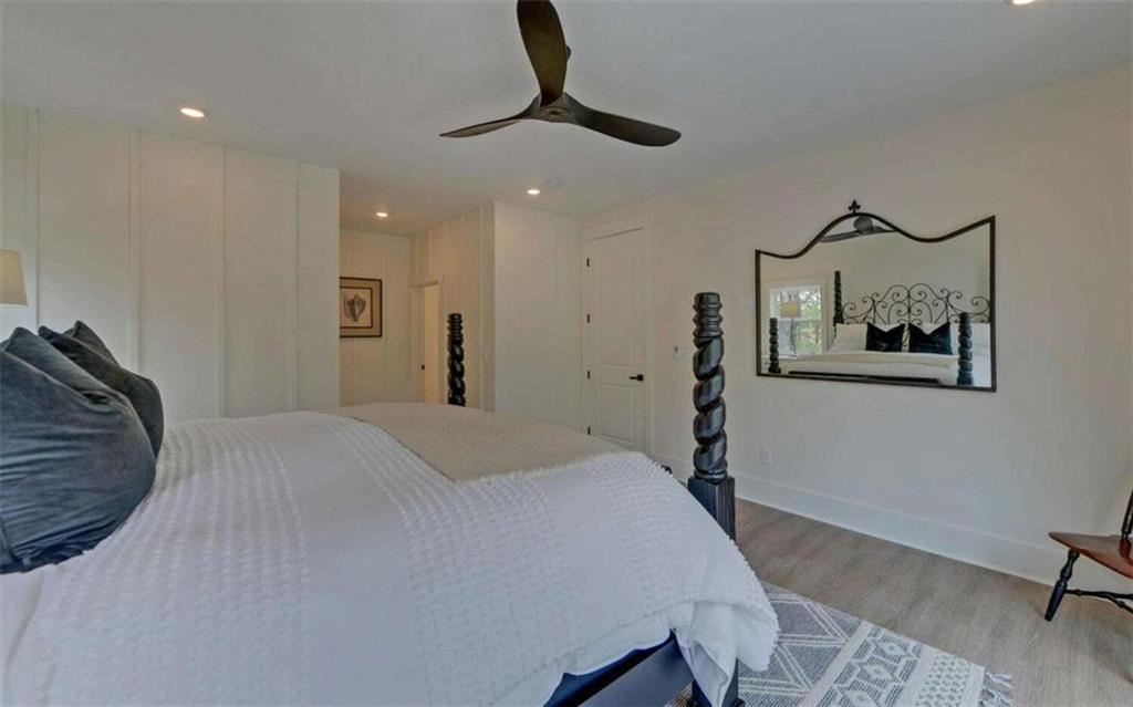 333 Favor Rabun Gap, GA 30568 - Photo 70 of 97 a bedroom with a bed and a chandelier