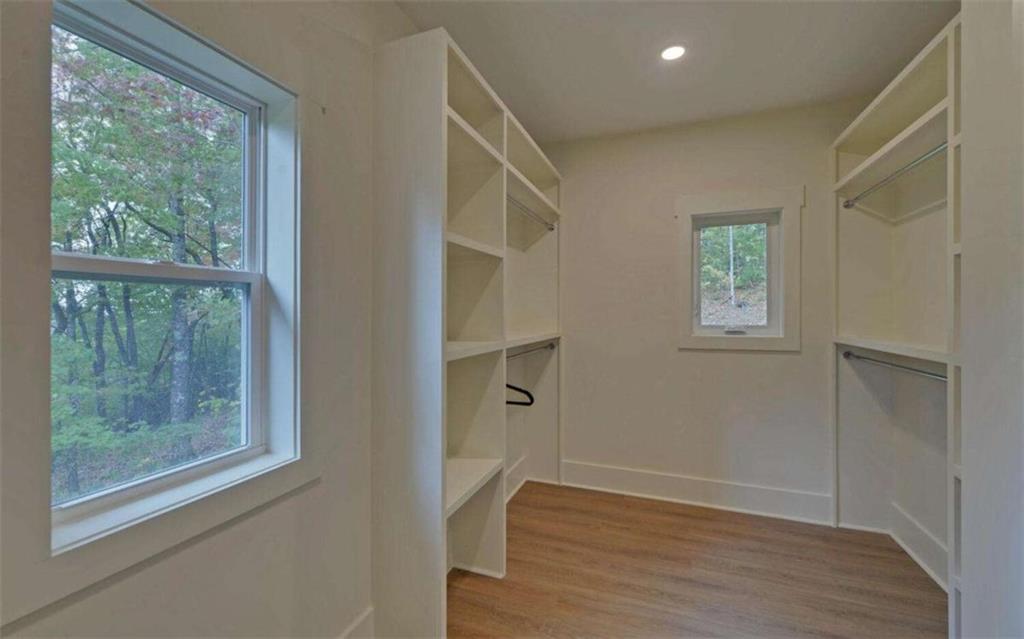 333 Favor Rabun Gap, GA 30568 - Photo 71 of 97 a view of an empty room with wooden floor and a window