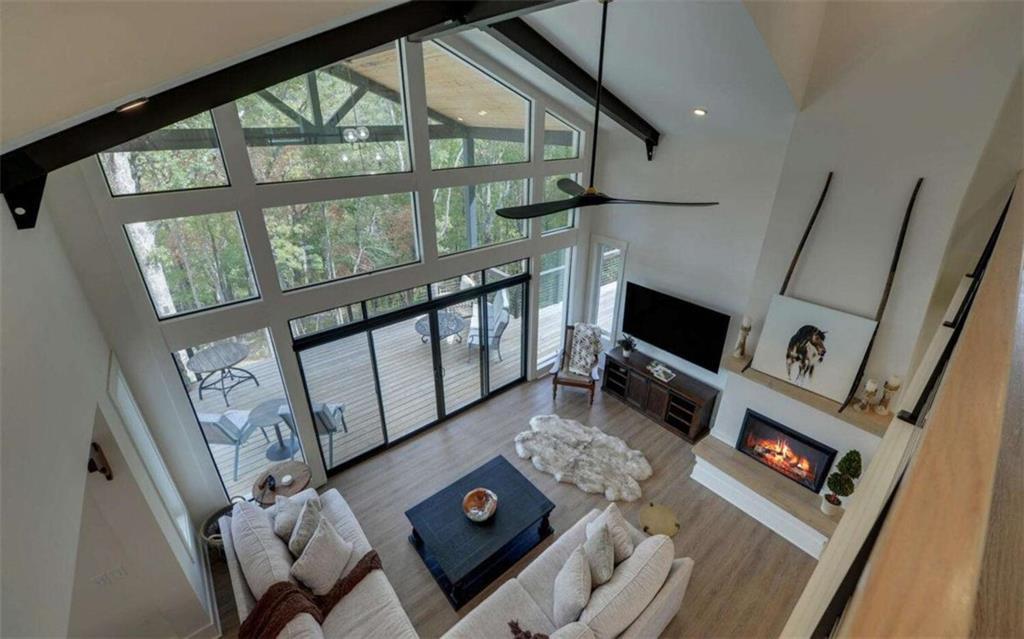 333 Favor Rabun Gap, GA 30568 - Photo 76 of 97 a living room with furniture and a floor to ceiling window