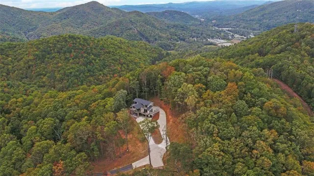 a view of a balcony with wooden floor and fence