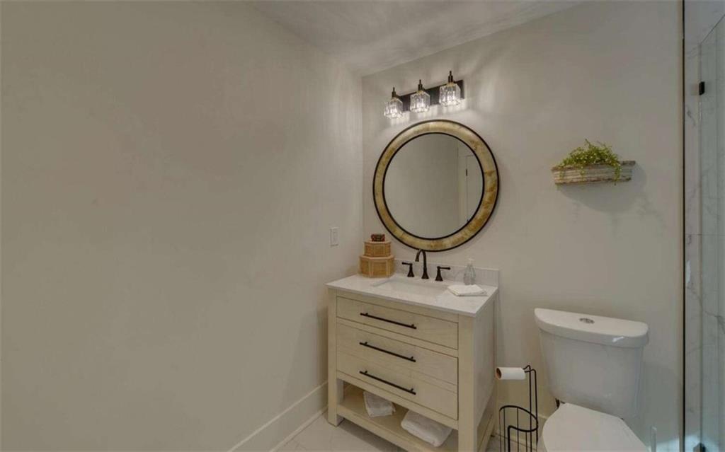 333 Favor Rabun Gap, GA 30568 - Photo 81 of 97 a bathroom with a sink mirror vanity and toilet
