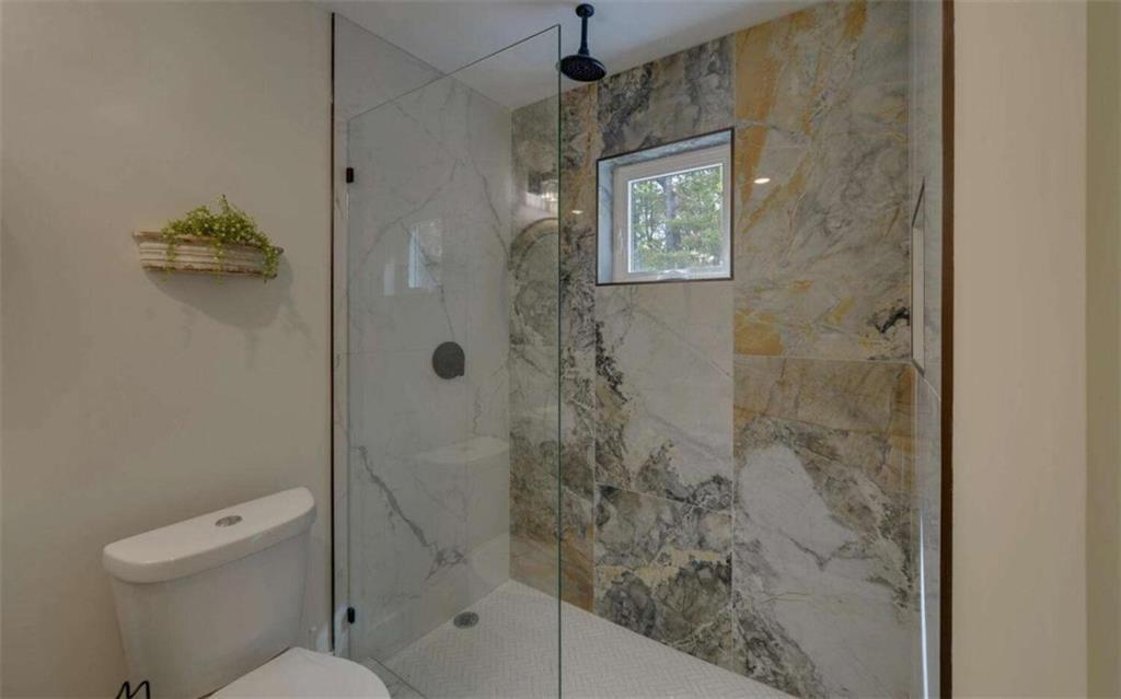 333 Favor Rabun Gap, GA 30568 - Photo 82 of 97 a bathroom with a shower a toilet and a sink