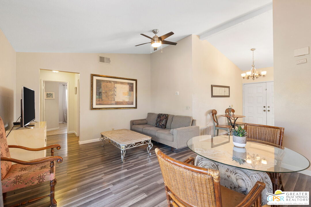 45688 Sutter Creek Road Indio, CA 92201 - Photo 20 of 51 a living room with furniture a fireplace and a flat screen tv