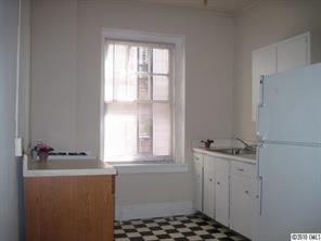 508 North Tryon Street, Unit 221 Charlotte, NC 28202 - Photo 5 of 10 a bathroom with a sink a window and a mirror