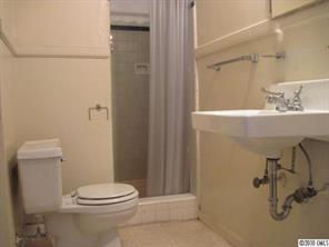 508 North Tryon Street, Unit 221 Charlotte, NC 28202 - Photo 7 of 10 a bathroom with a sink a toilet and shower