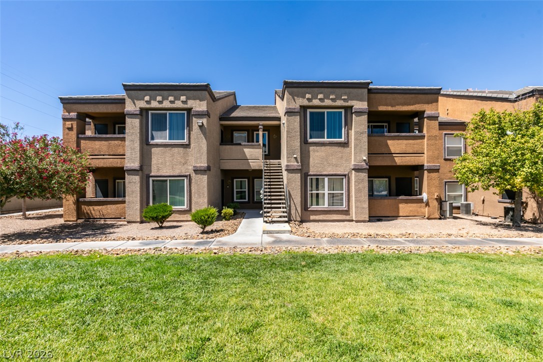 6650 West Warm Springs Road, Unit 2118 Las Vegas, NV 89118 - Photo 32 of 41 A contemporary multi-level building offers comfortable living with well-kept landscaping.