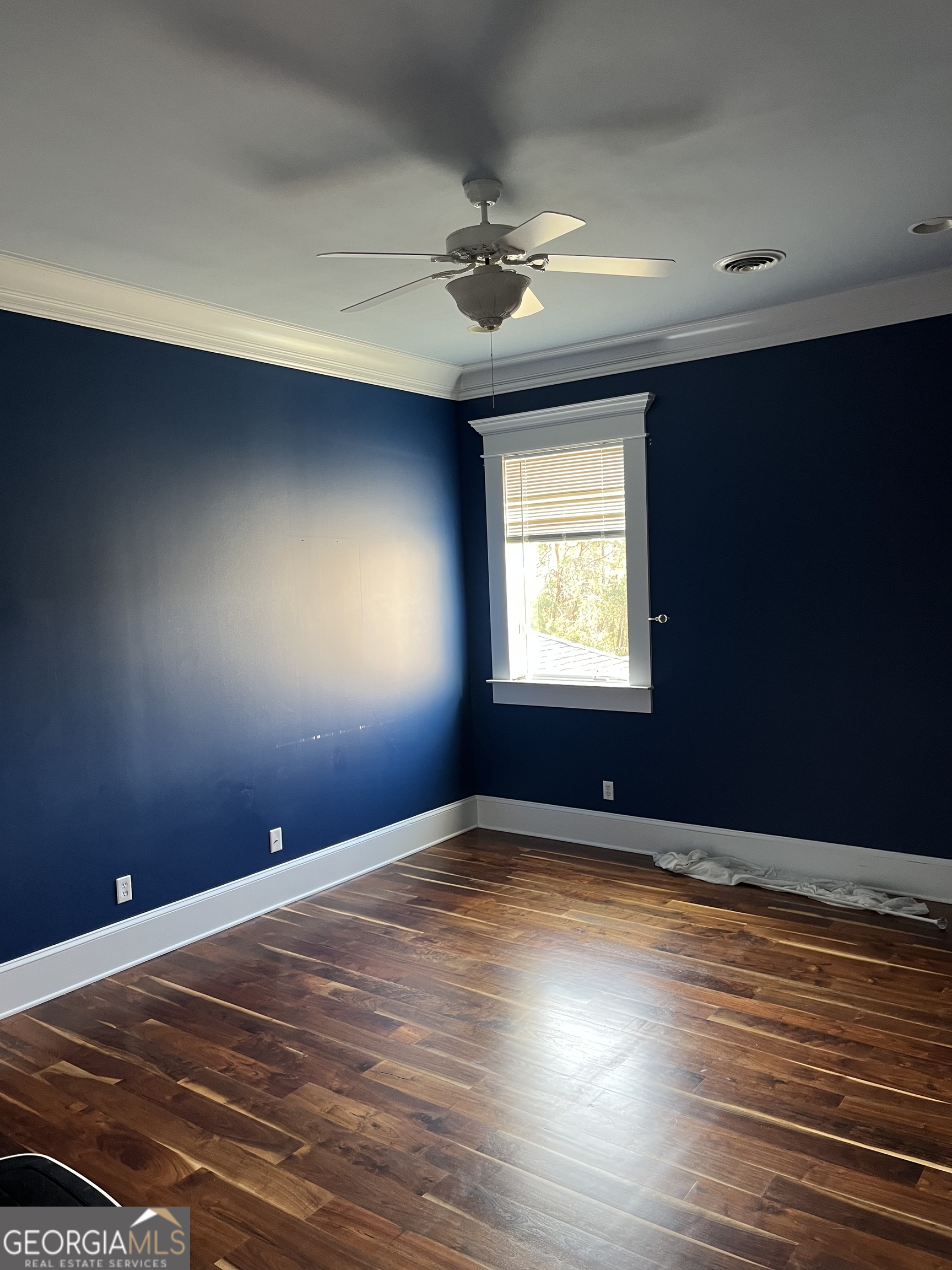 87 Ridgeview Lane Ringgold, GA 30736 - Photo 21 of 32 a view of an empty room with window and wooden floor