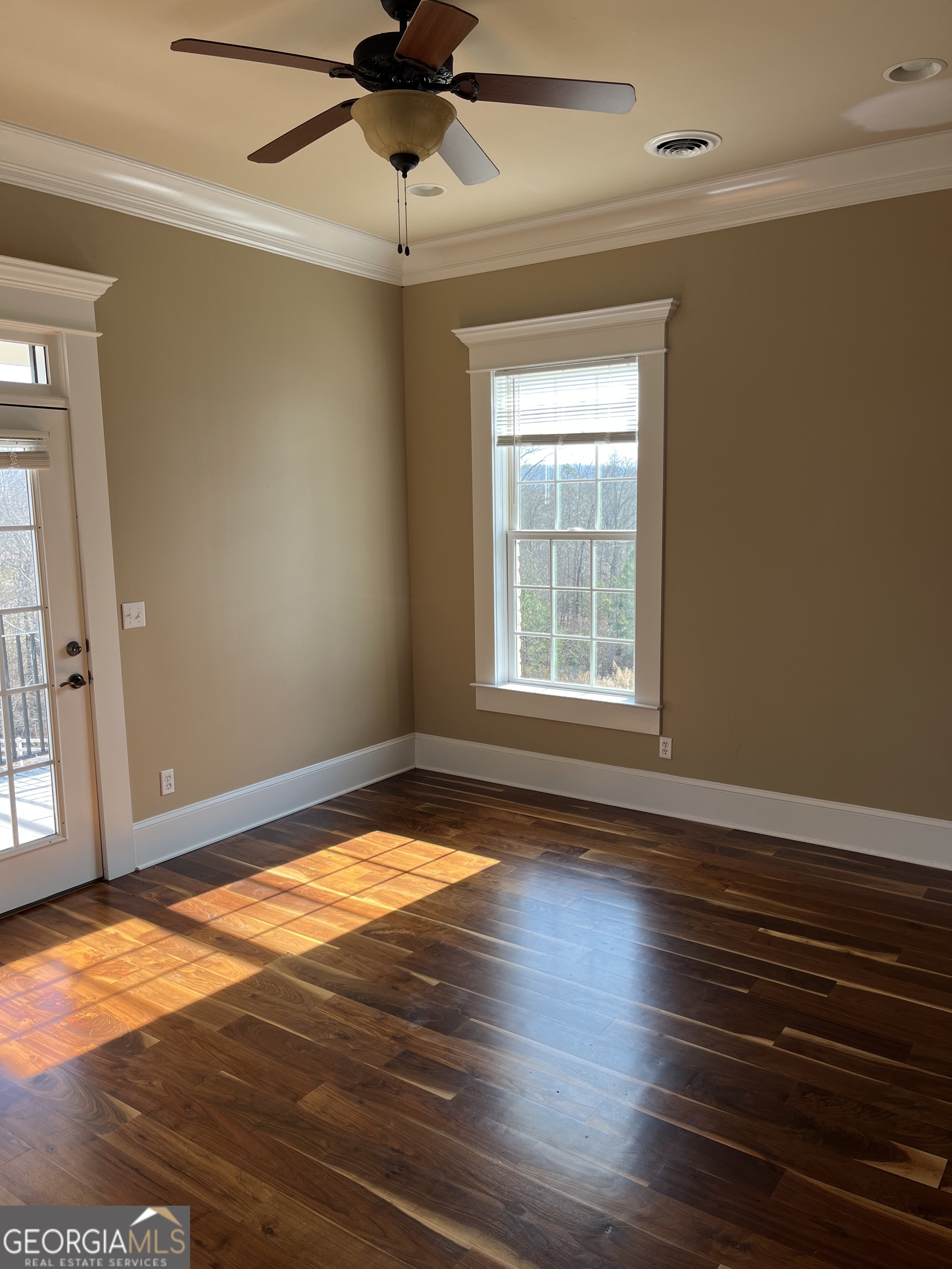 87 Ridgeview Lane Ringgold, GA 30736 - Photo 22 of 32 a view of empty room with wooden floor and fan
