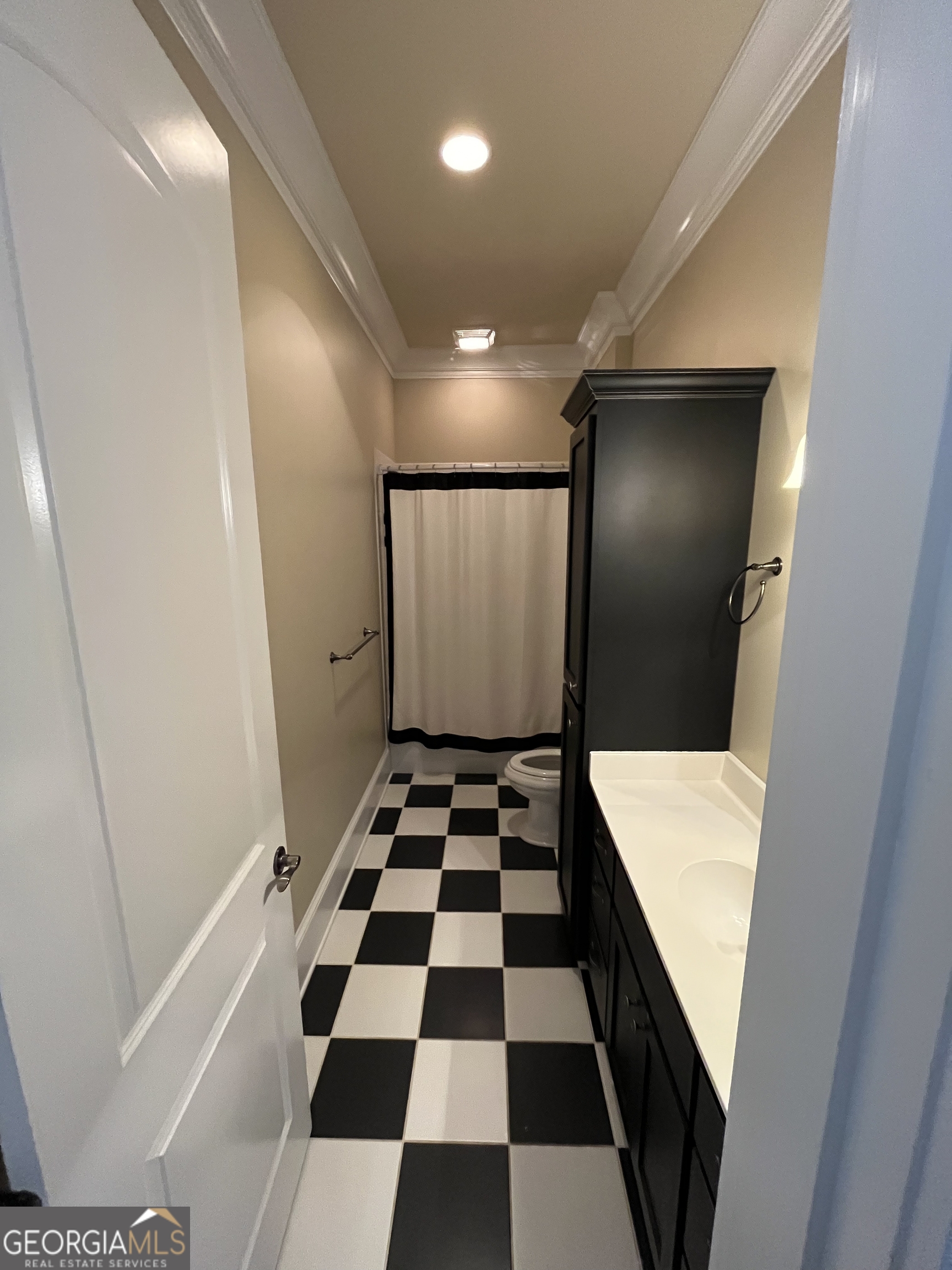 87 Ridgeview Lane Ringgold, GA 30736 - Photo 26 of 32 a bathroom with a black and white checkered floor