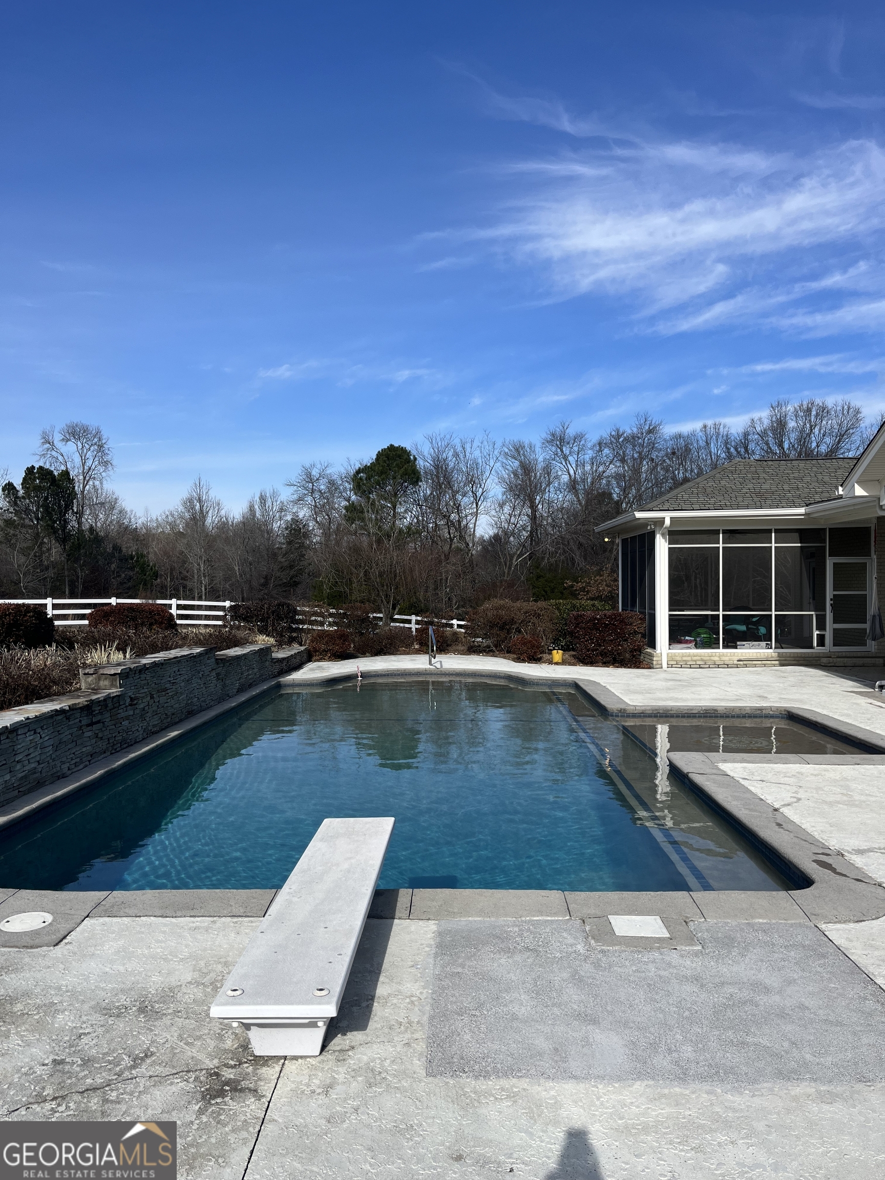 87 Ridgeview Lane Ringgold, GA 30736 - Photo 5 of 32 a view of a swimming pool with lounge chair