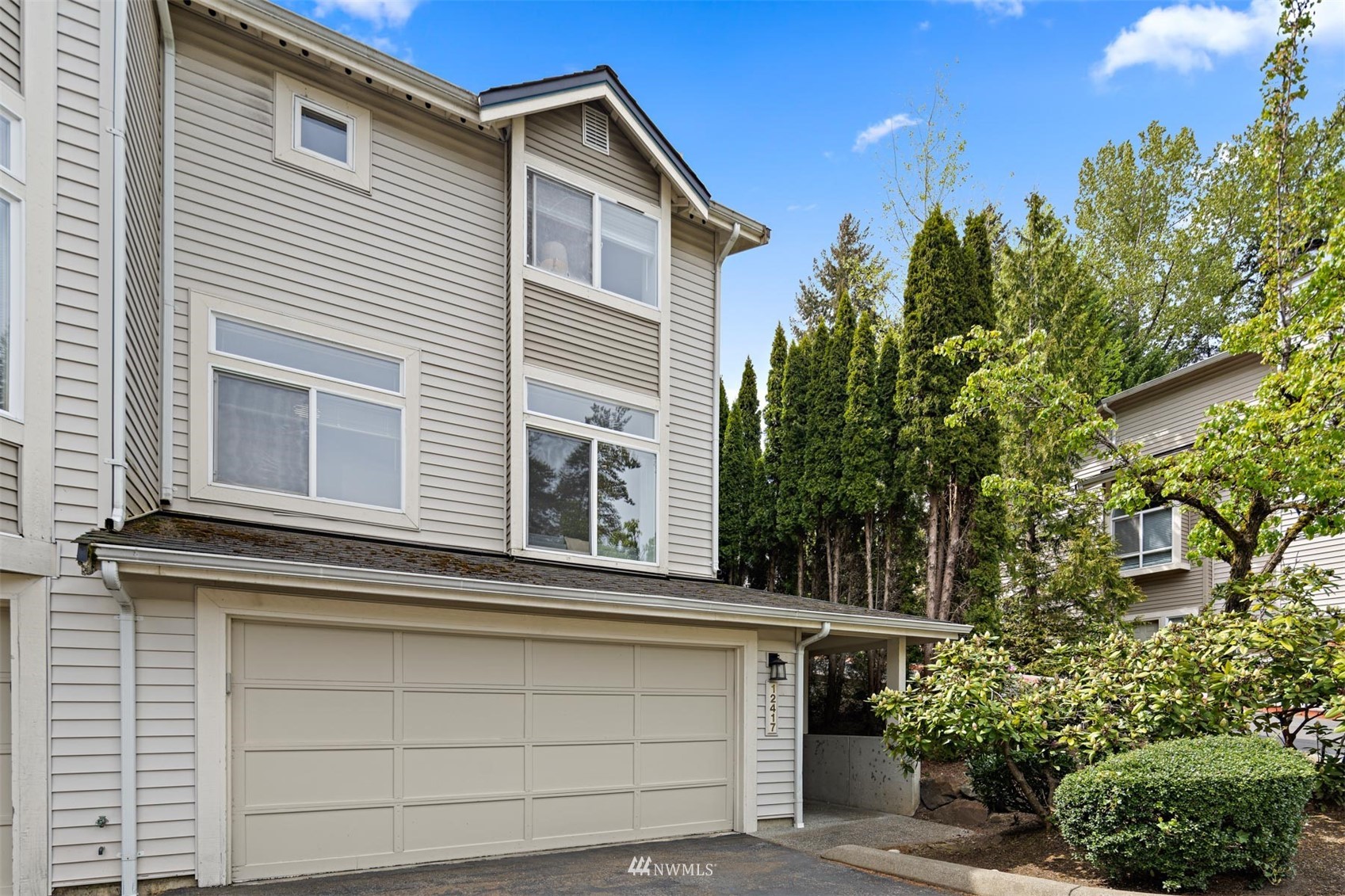 12417 Northeast 7th Place Bellevue, WA 98005 - Photo 1 of 33 a view of a house with a garage