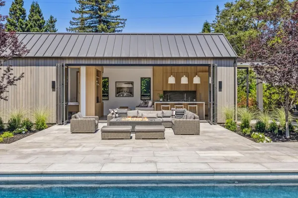 a view of outdoor kitchen and living room