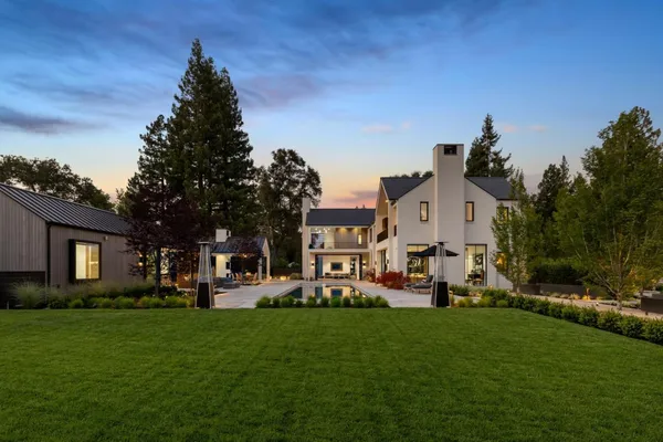 a view of a house with a back yard