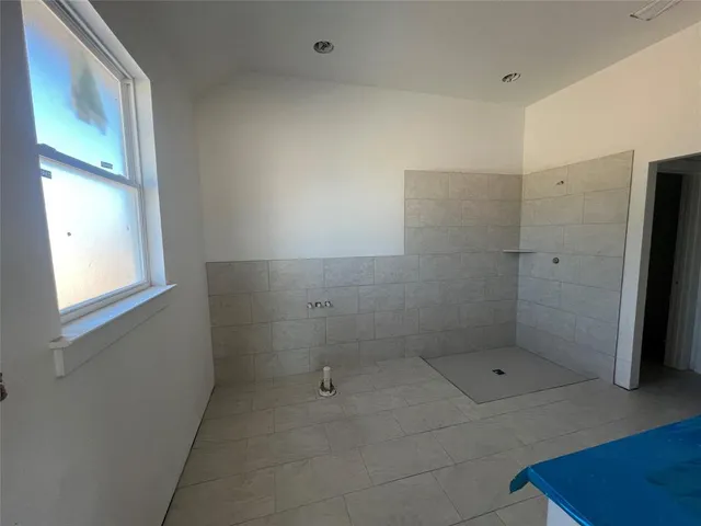 a bathroom with a small window