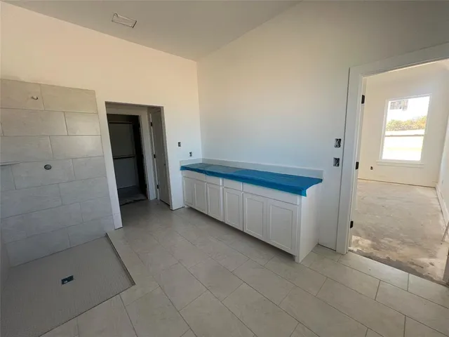 a bathroom with a bathtub and a shower