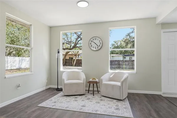 a living room with furniture and a window