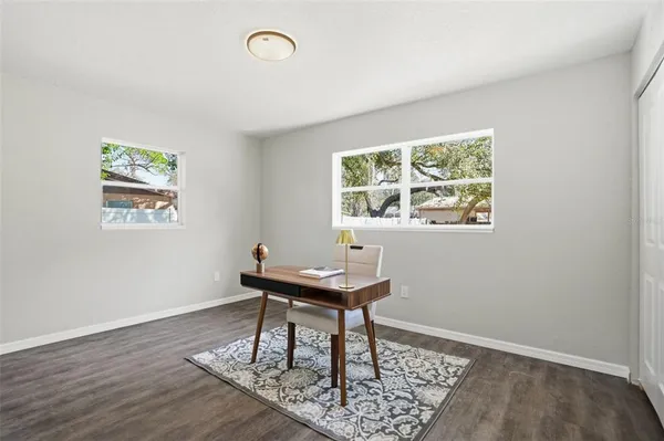 a workspace with furniture and a window